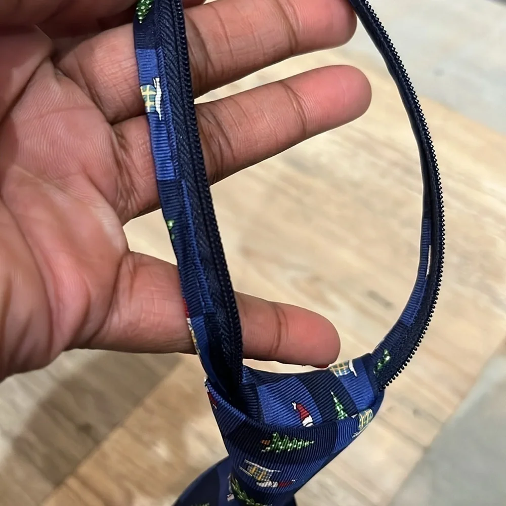Canterbury Child’s zip neck tie Blue Christmas design decorated zipper